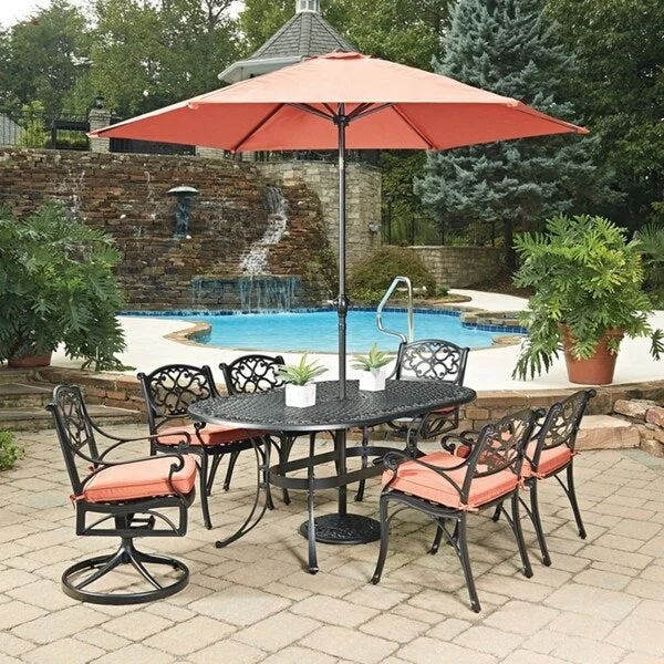 Biscayne Rust Bronze Round 9-piece Outdoor Dining Set with Cushioned Arm and Swivel Rocking Chairs and Umbrella by Home Styles