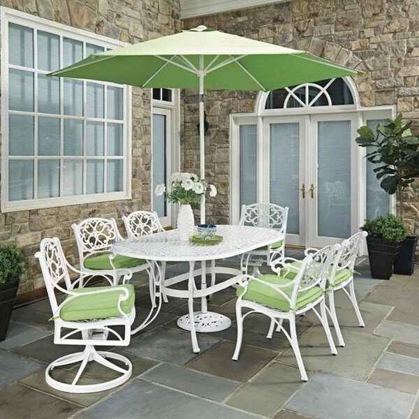 Biscayne White 9-piece Oval Outdoor Dining Set with Cushioned Arm and Swivel Rocking Chairs and Umbrella by Home Styles