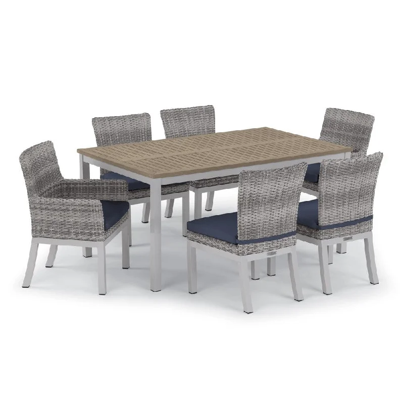 Oxford Garden Travira 7-piece 63-in x 40-in Tekwood Table & Argento Resin Wicker Arm & Side Chair Set - Midnight Blue Cushions